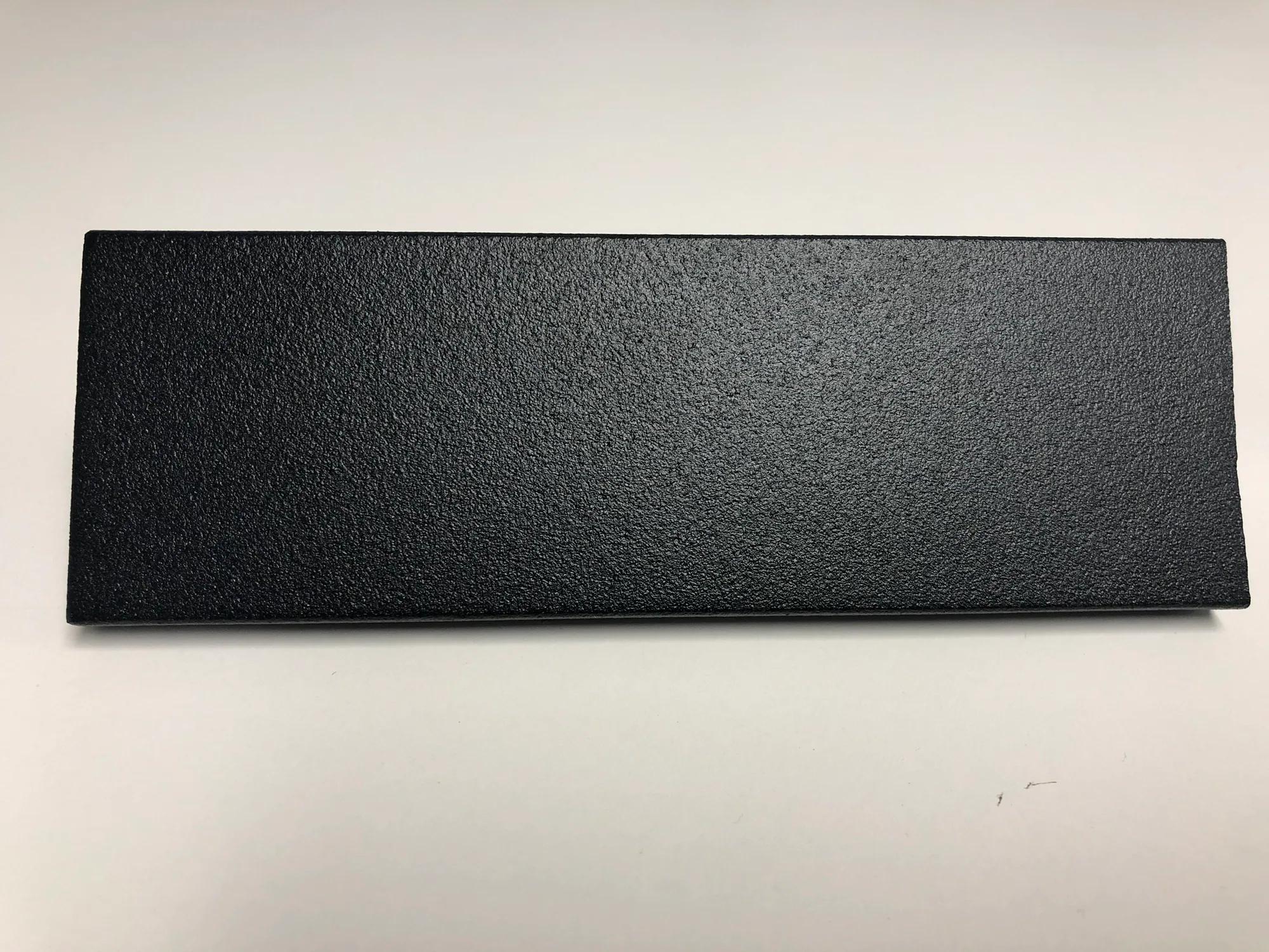Black textured powder-coated elevator handrail sample