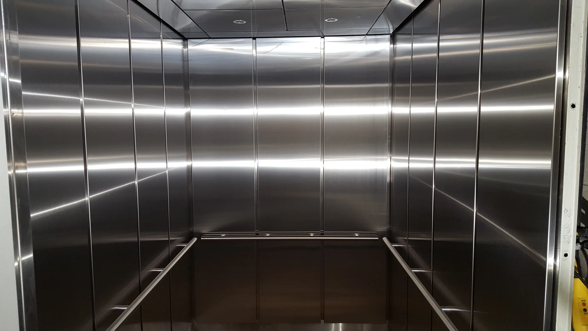 Wide stainless elevator interior at Sulzer Library in Chicago